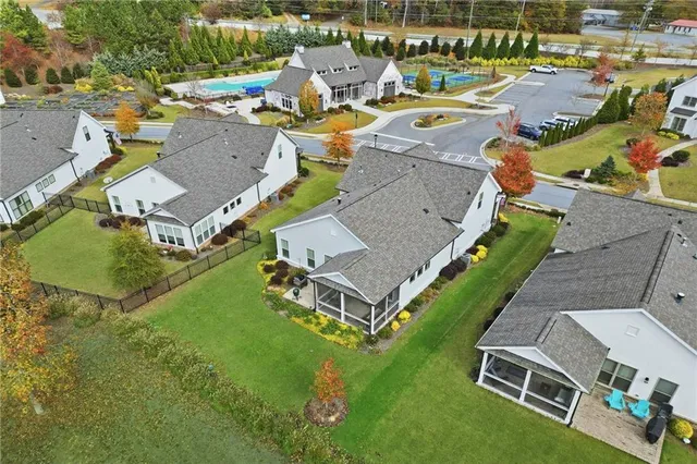 an aerial view of a house with a garden and swimming pool