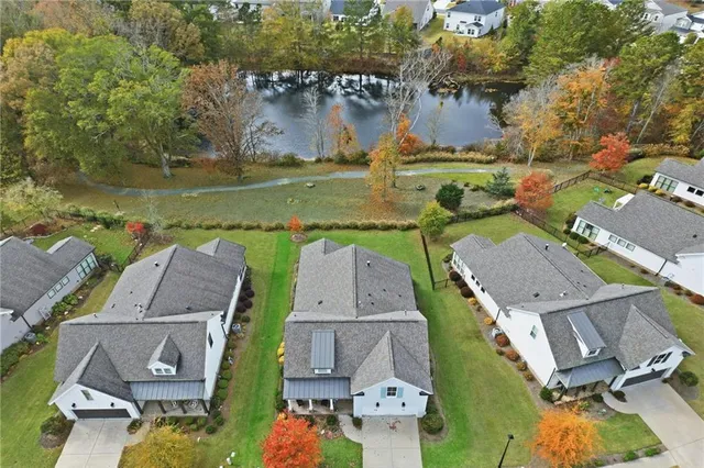 an aerial view of residential houses with outdoor space