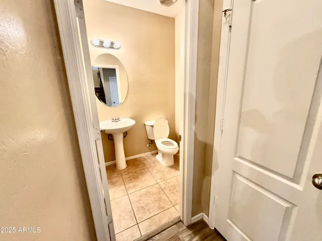 a view of walk in closet with wooden floor
