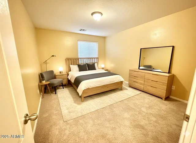 a large kitchen with a counter space a sink and cabinets