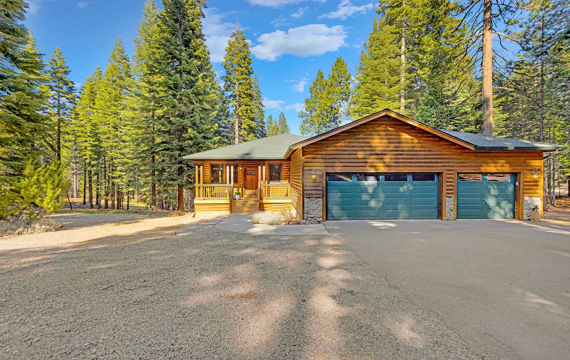 627 Deep Forest Road Lake Almanor, CA 96137 - Photo 26 of 29 front view of a house with a yard