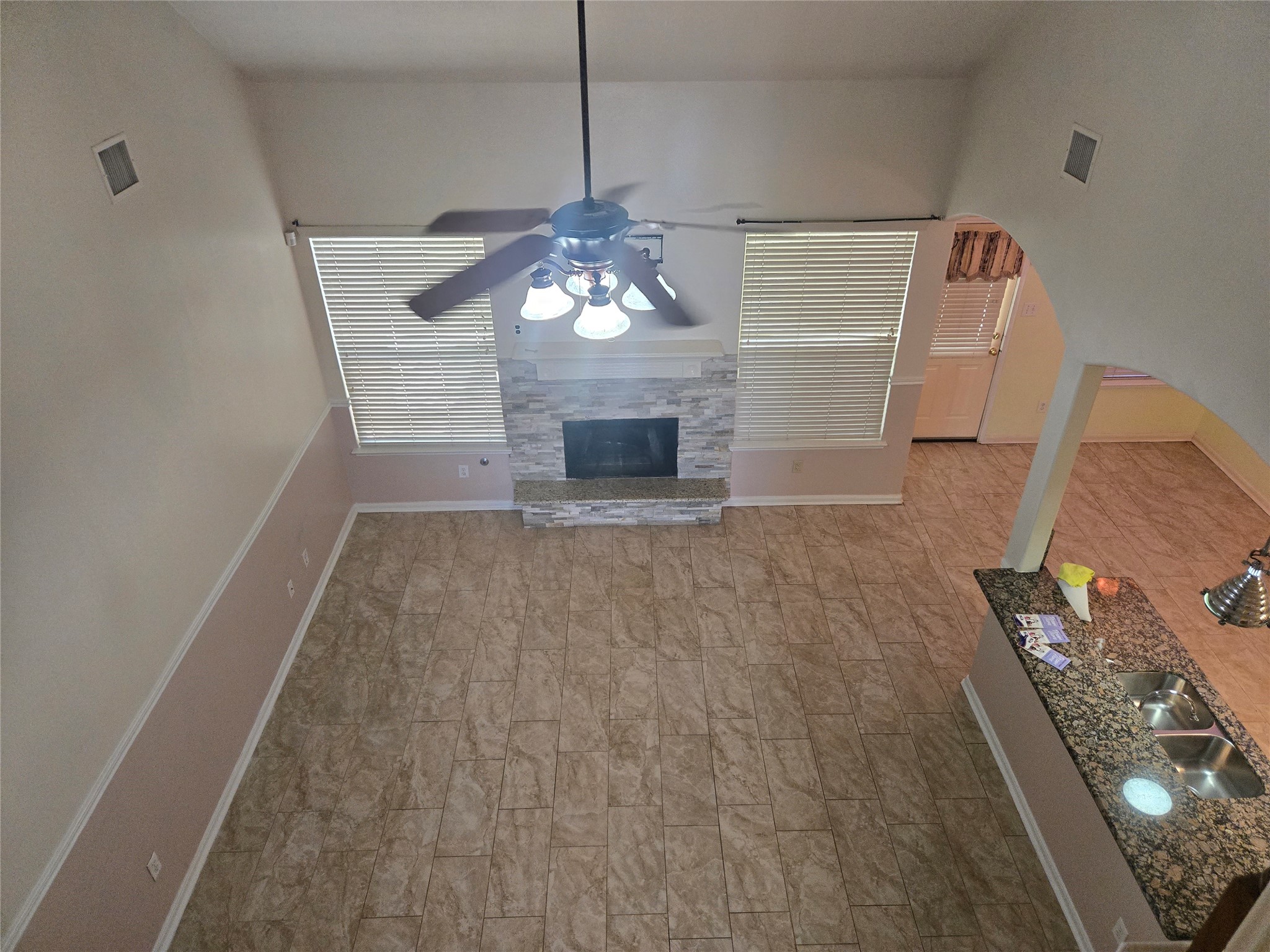 3818 Ridge Canyon Road Baytown, TX 77521 - Photo 5 of 32 a view of a livingroom with wooden floor and a fireplace