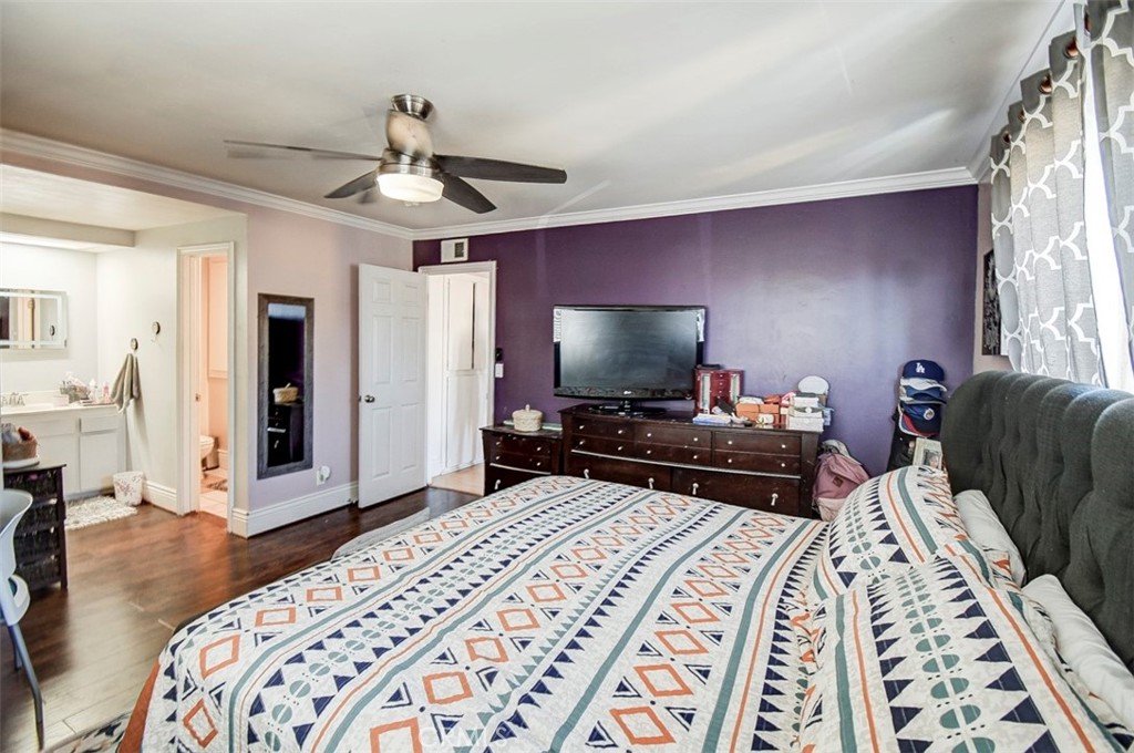 2119 West Edinger Avenue, Unit A Santa Ana, CA 92704 - Photo 20 of 24 a bedroom with bed and a flat screen tv