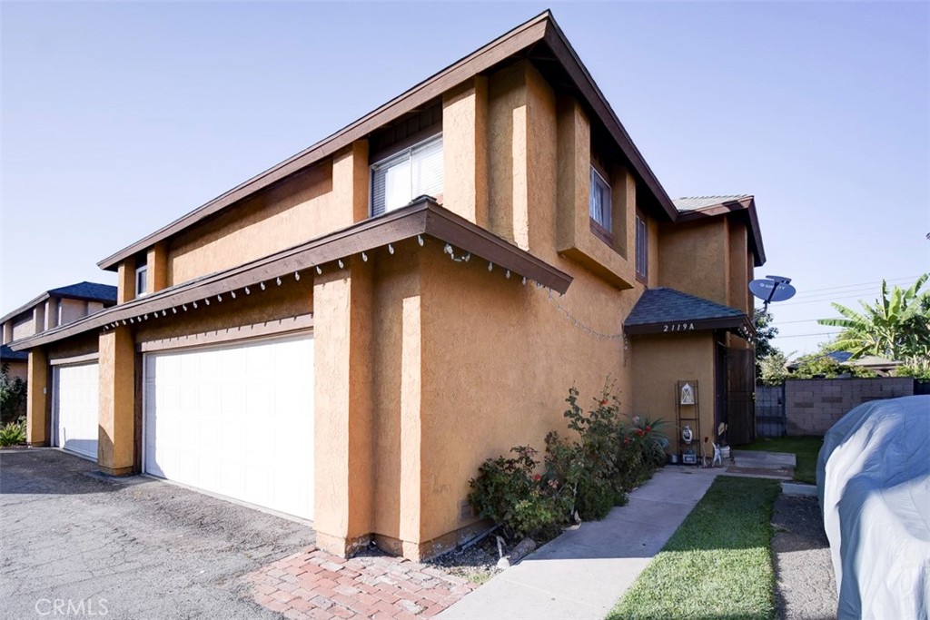 2119 West Edinger Avenue, Unit A Santa Ana, CA 92704 - Photo 2 of 24 a front view of house with yard