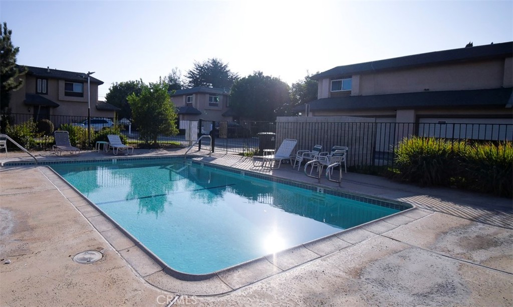 2119 West Edinger Avenue, Unit A Santa Ana, CA 92704 - Photo 23 of 24 a view of a swimming pool with outdoor seating and plants