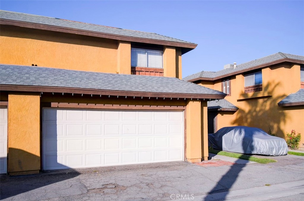 2119 West Edinger Avenue, Unit A Santa Ana, CA 92704 - Photo 3 of 24 a front view of a house with a garage