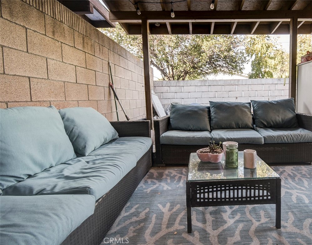 2119 West Edinger Avenue, Unit A Santa Ana, CA 92704 - Photo 10 of 24 a living room with furniture and a large window