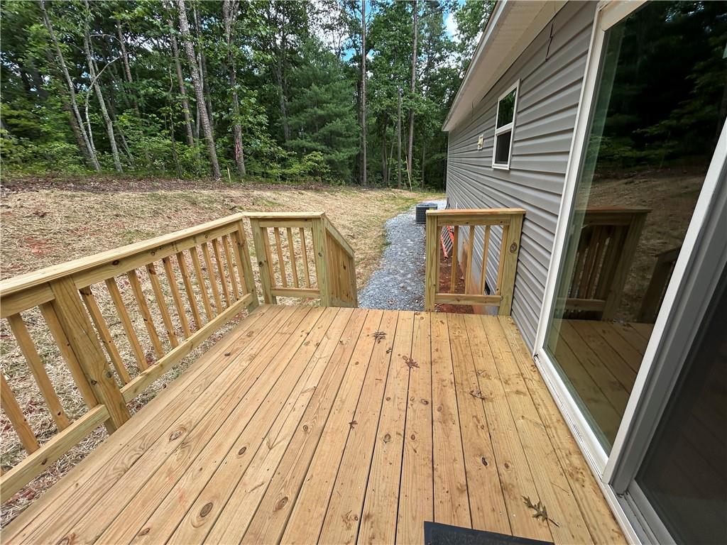 564 Ridge Road Dawsonville, GA 30534 - Photo 11 of 25 a view of balcony with wooden floor and outdoor space