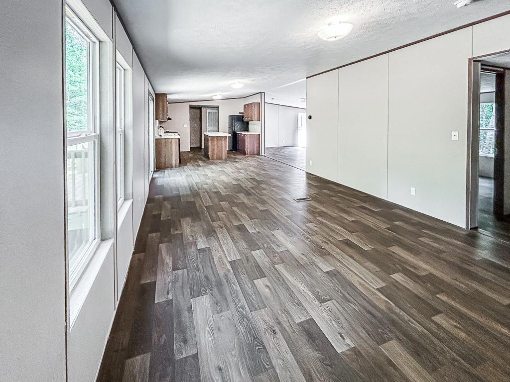 564 Ridge Road Dawsonville, GA 30534 - Photo 20 of 25 a view of a hallway with wooden floor and stairs