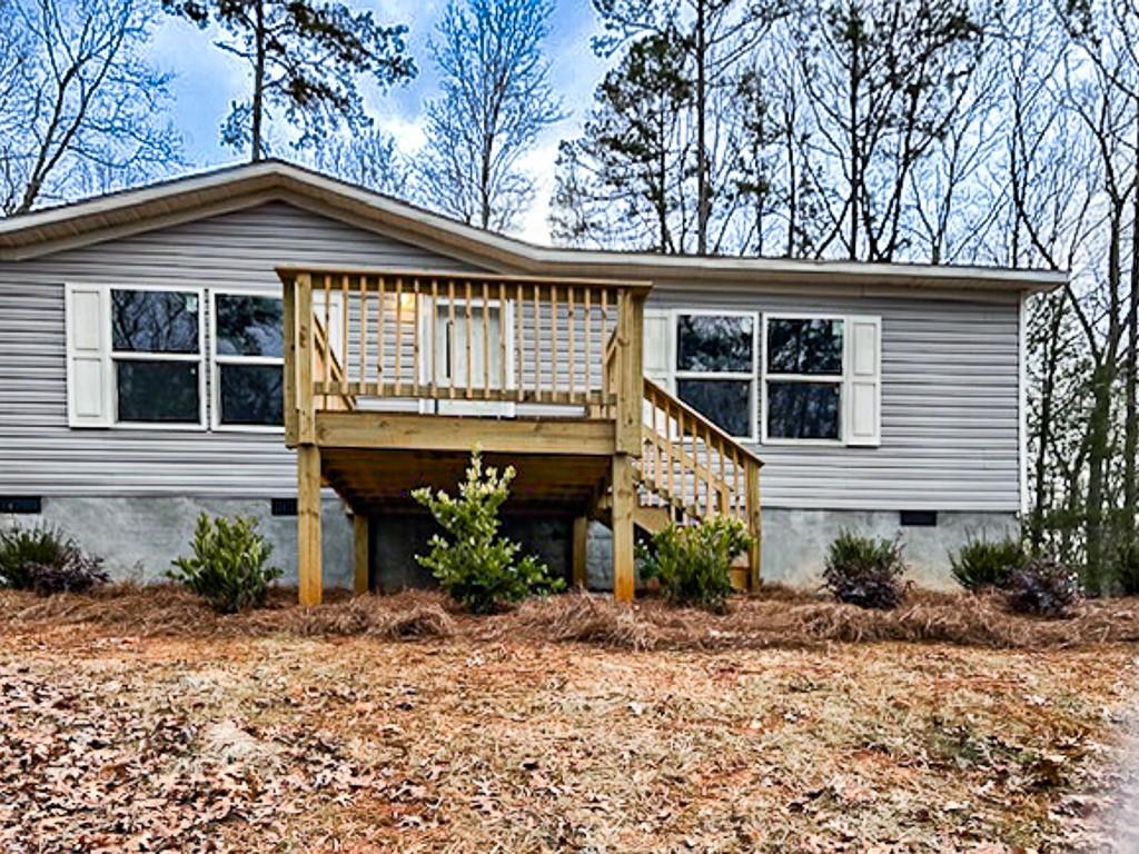 564 Ridge Road Dawsonville, GA 30534 - Photo 2 of 25 a front view of a house with garden