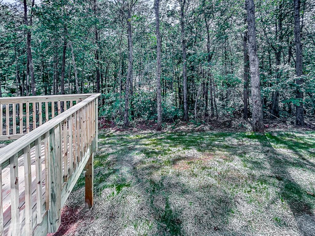 564 Ridge Road Dawsonville, GA 30534 - Photo 22 of 25 a view of deck with green trees