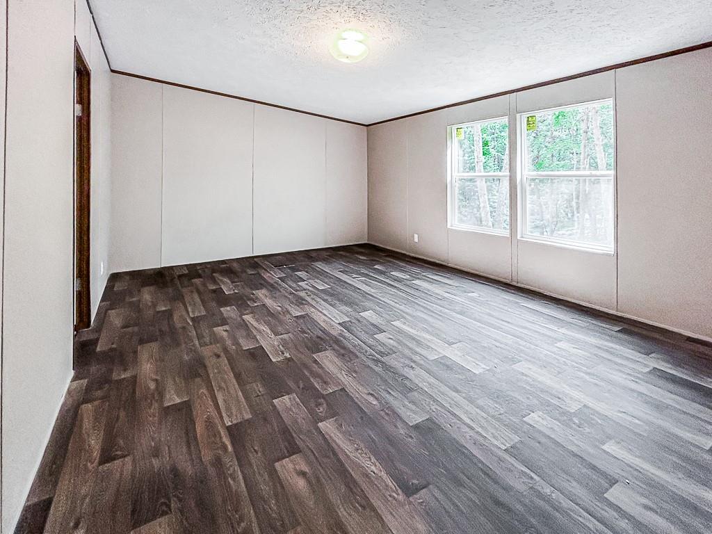 564 Ridge Road Dawsonville, GA 30534 - Photo 23 of 25 a view of an empty room with wooden floor and a window