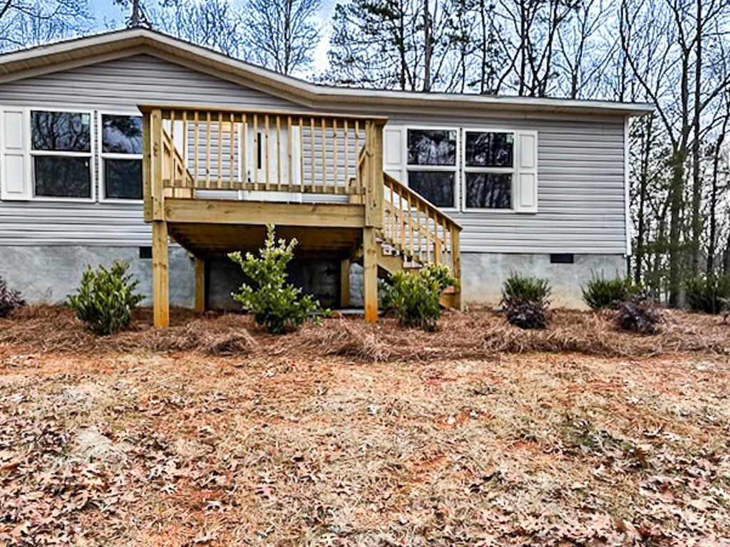 564 Ridge Road Dawsonville, GA 30534 - Photo 24 of 25 a front view of a house with garden