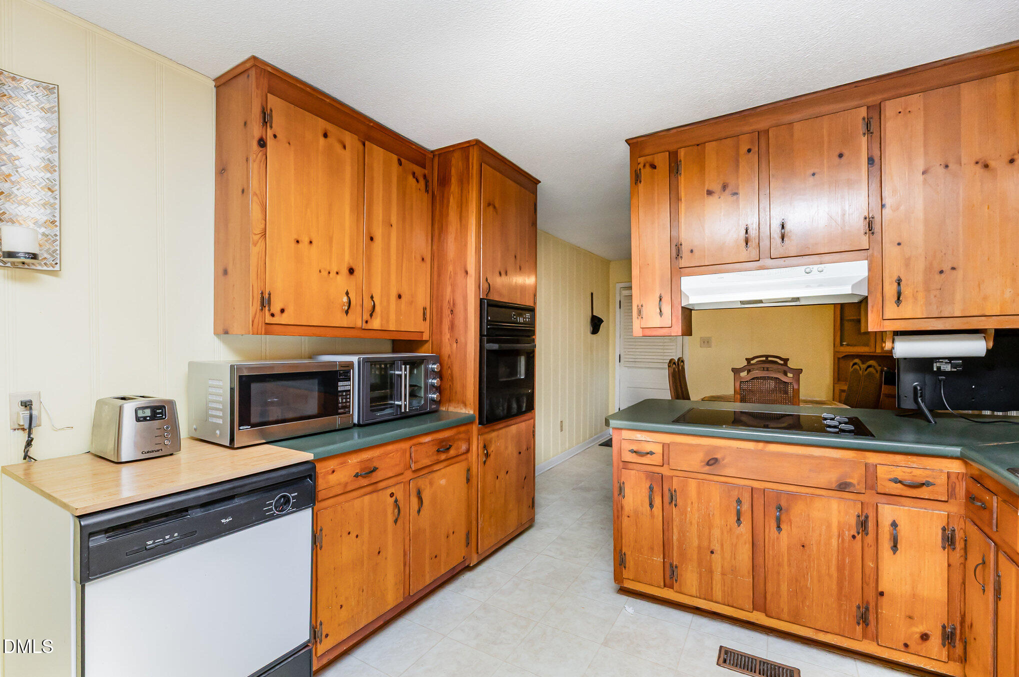3009 Hickory Road Raleigh, NC 27616 - Photo 5 of 19 a kitchen with stainless steel appliances granite countertop a stove a sink and a microwave