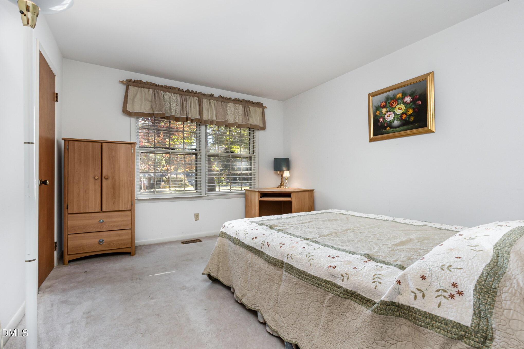 3009 Hickory Road Raleigh, NC 27616 - Photo 6 of 19 a bed sitting in a bedroom next to a window