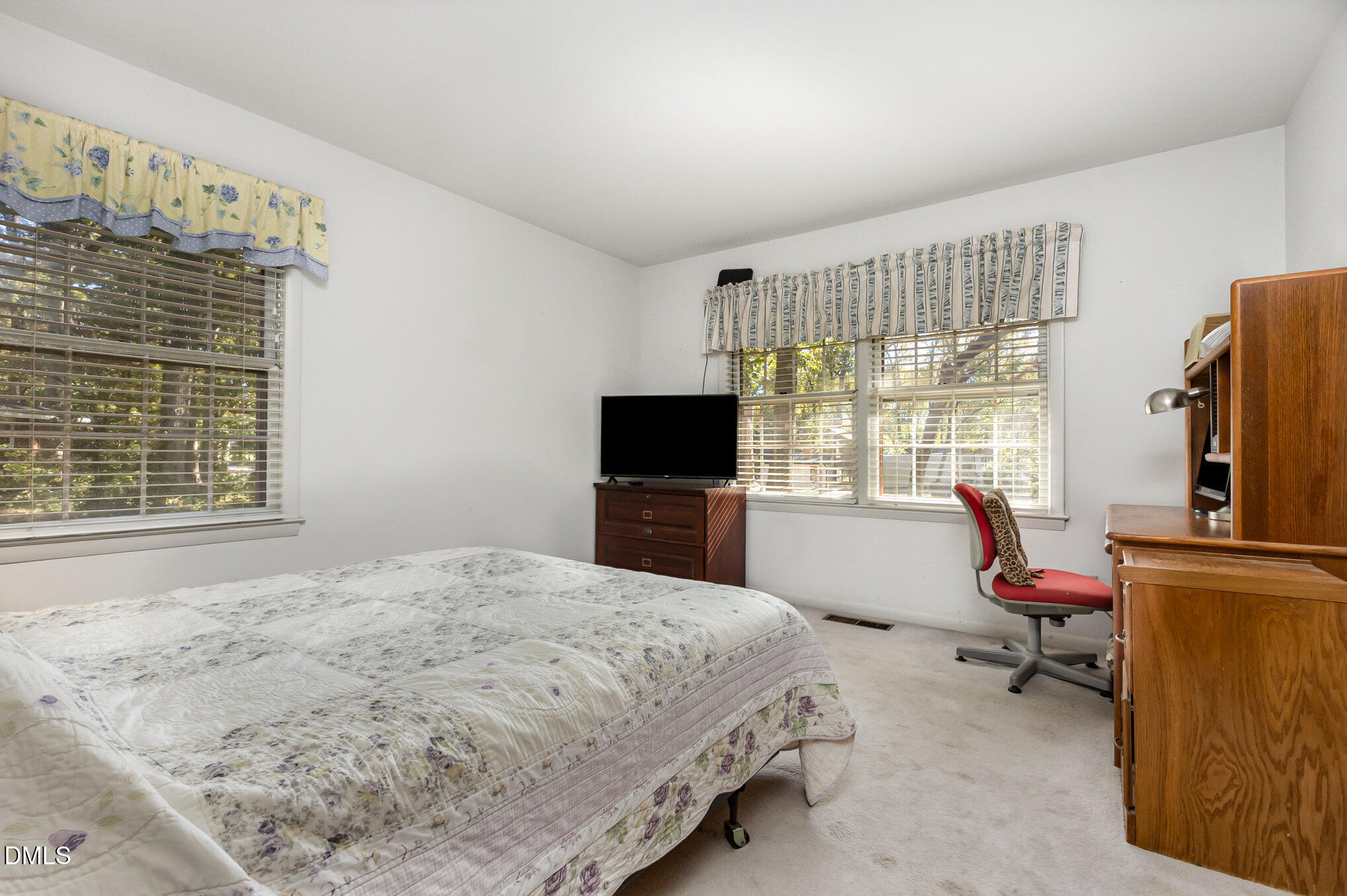 3009 Hickory Road Raleigh, NC 27616 - Photo 7 of 19 a bedroom with a bed a chair and computer on the desk