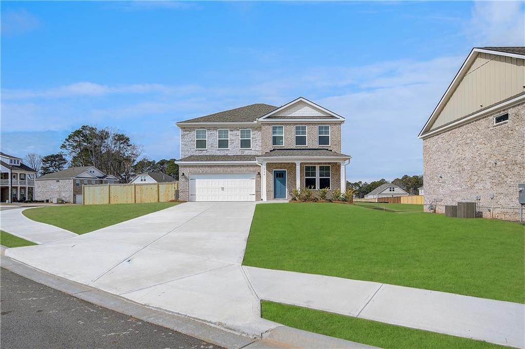 a front view of a house with a yard