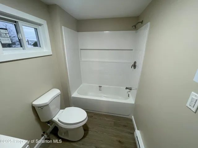 a view of bathroom with a sink and mirror