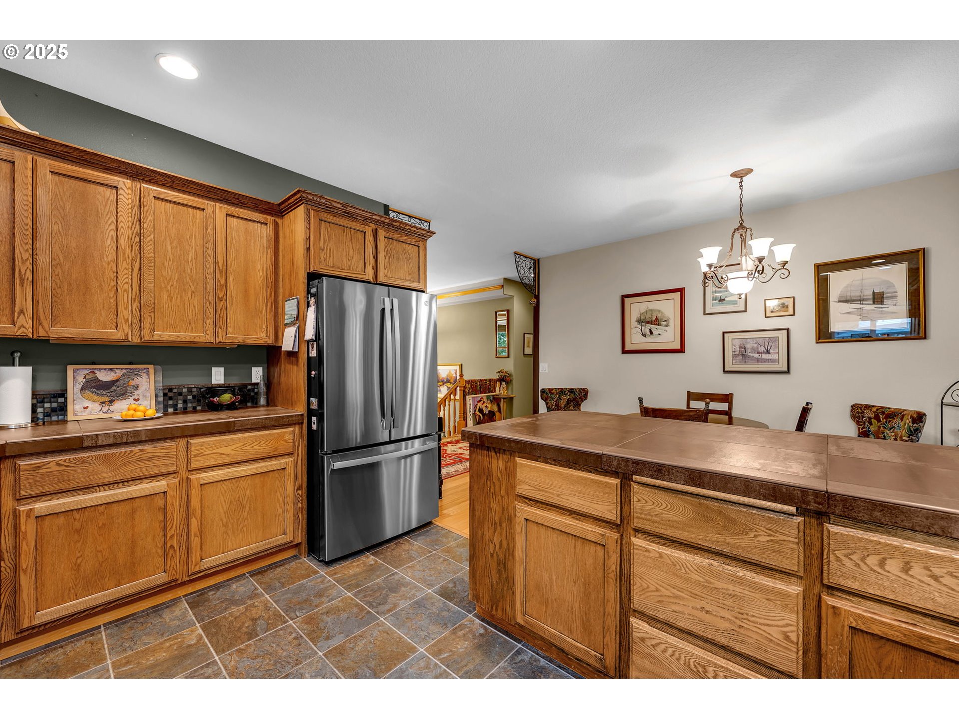 1035 East Pioneer Loop La Center, WA 98629 - Photo 13 of 43 a kitchen with a refrigerator sink and cabinets