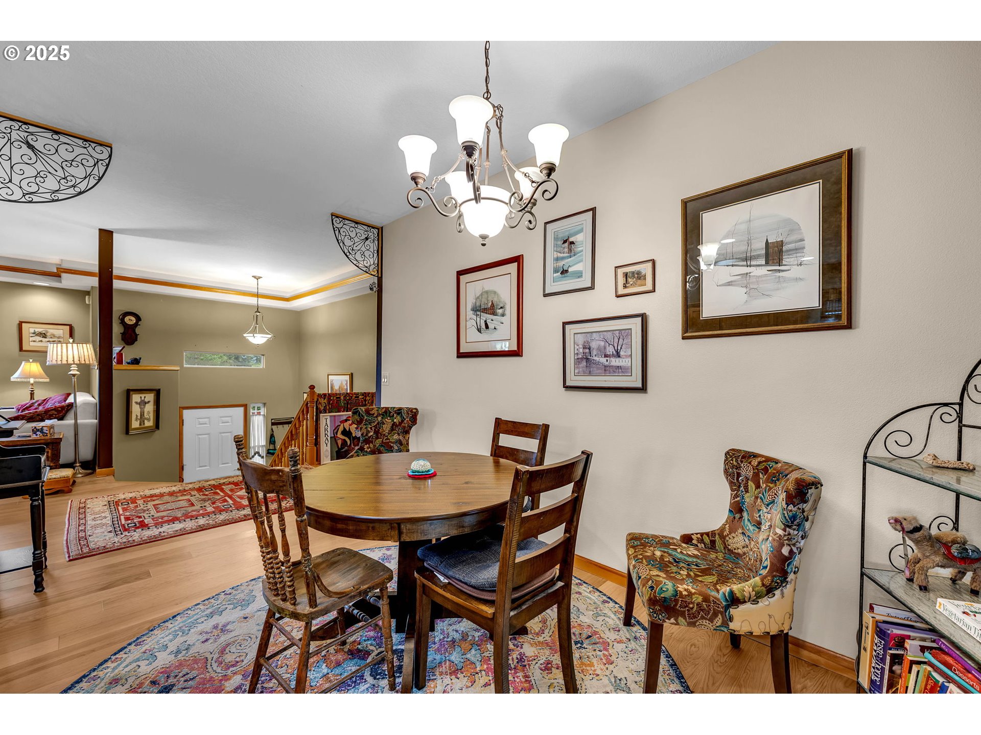 1035 East Pioneer Loop La Center, WA 98629 - Photo 16 of 43 a view of a dining room with furniture and chandelier
