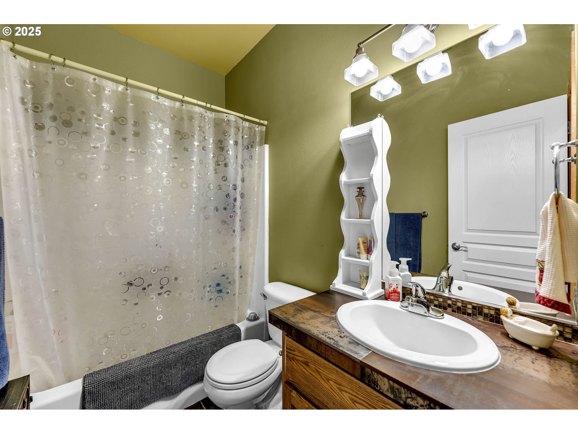 1035 East Pioneer Loop La Center, WA 98629 - Photo 27 of 43 a bathroom with a sink and a mirror