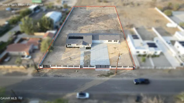 a view of kitchen with wooden floor and electronic appliances
