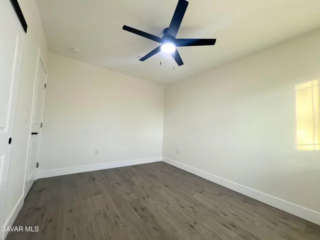a bathroom with a toilet and a bath tub
