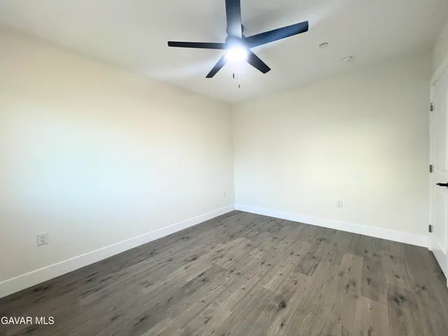 a bathroom with a toilet and a bath tub