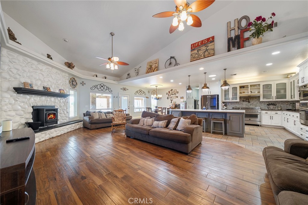 7172 Jargon Road Hesperia, CA 92344 - Photo 10 of 75 a living room with furniture kitchen view and a chandelier