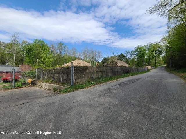 a view of a street with a building in the background