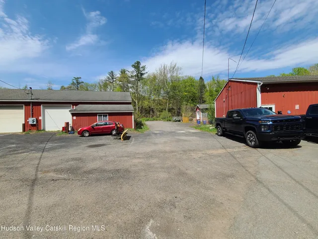a view of a street with a building in the background