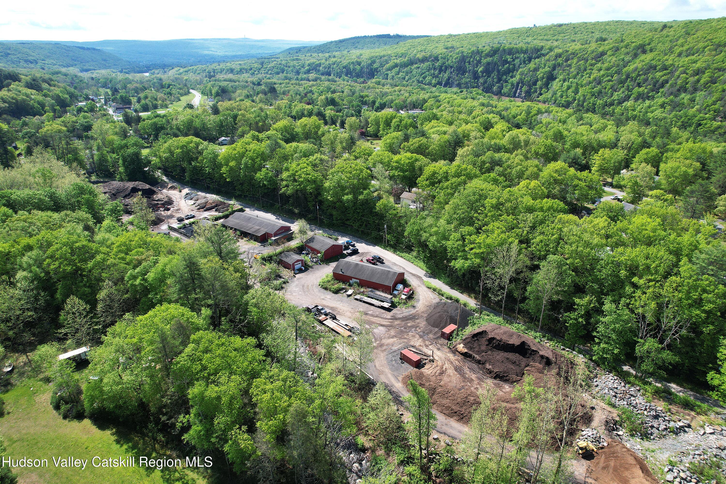 26-48 Hook Road Sparrow Bush, NY 12780 - Photo 31 of 32 an aerial view of a house with a lush green forest