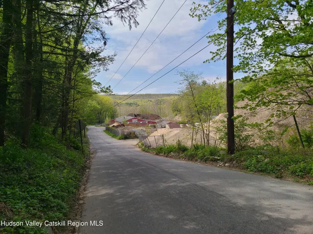 a view of a pathway with a yard
