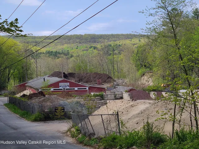 a view of a street with a yard