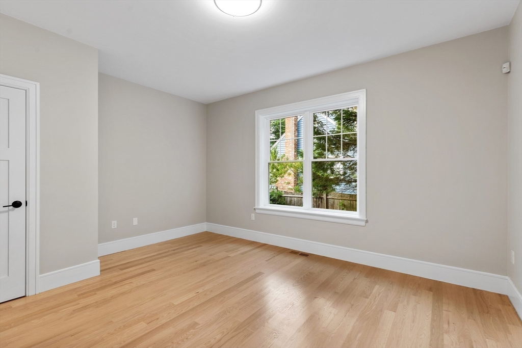 12 Pleasant Street Burlington, MA 01803 - Photo 13 of 30 an empty room with wooden floor and windows