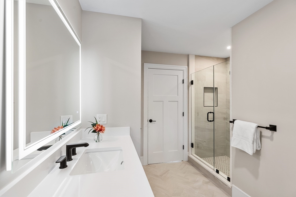 12 Pleasant Street Burlington, MA 01803 - Photo 22 of 30 a bathroom with a tub sink and shower