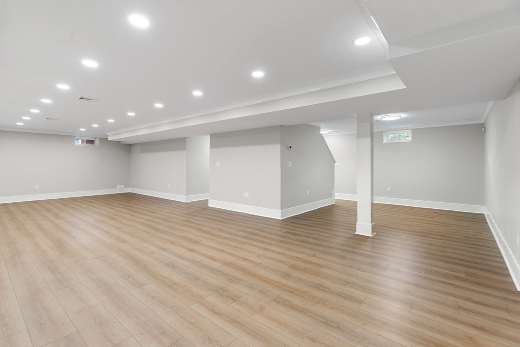 12 Pleasant Street Burlington, MA 01803 - Photo 24 of 30 a view of an empty room with wooden floor