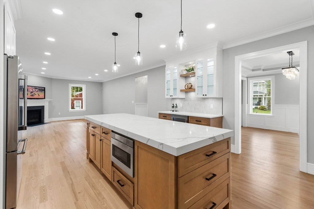 12 Pleasant Street Burlington, MA 01803 - Photo 6 of 30 a kitchen with a stove and a wooden floor