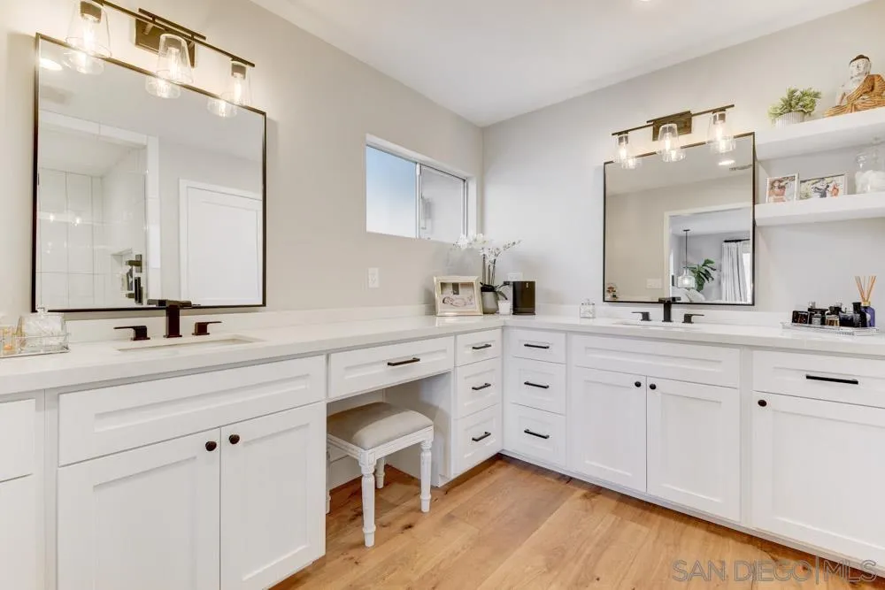 9944 Connell Road San Diego, CA 92131 - Photo 14 of 25 a spacious bathroom with a double vanity sink mirror and