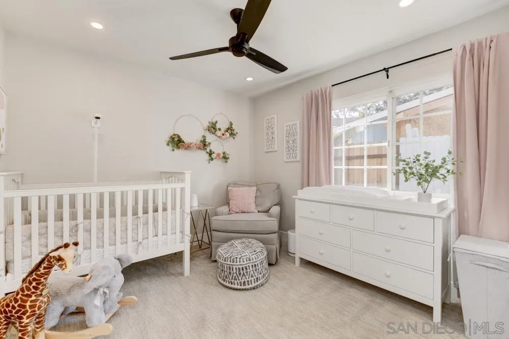 9944 Connell Road San Diego, CA 92131 - Photo 16 of 25 a bedroom with furniture and a window