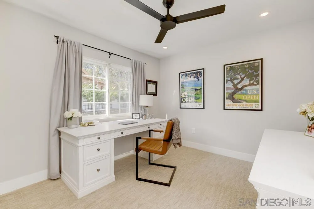 9944 Connell Road San Diego, CA 92131 - Photo 17 of 25 a view of a workspace with furniture and a window