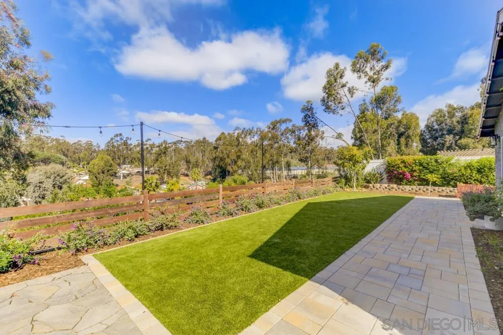 9944 Connell Road San Diego, CA 92131 - Photo 19 of 25 a view of yard with swimming pool and green space
