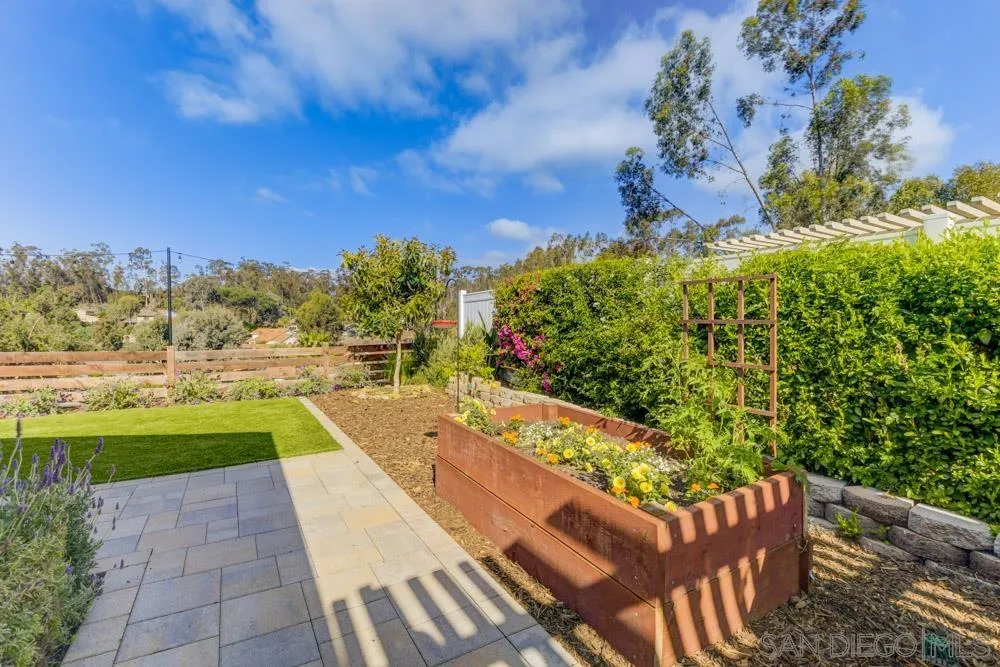 9944 Connell Road San Diego, CA 92131 - Photo 24 of 25 a view of a swimming pool with a lawn chairs and a yard