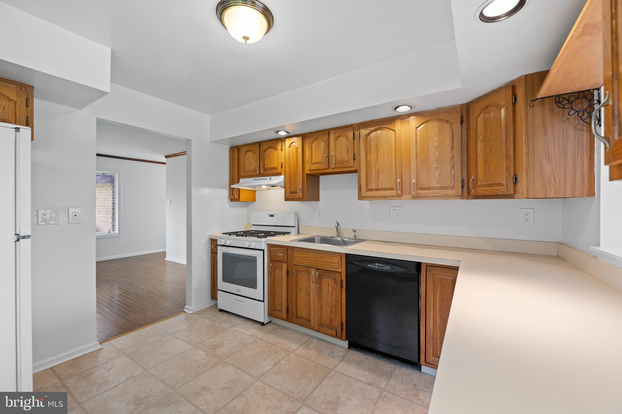 105 Timothy Circle Wayne, PA 19087 - Photo 12 of 31 a kitchen with a stove sink and cabinets