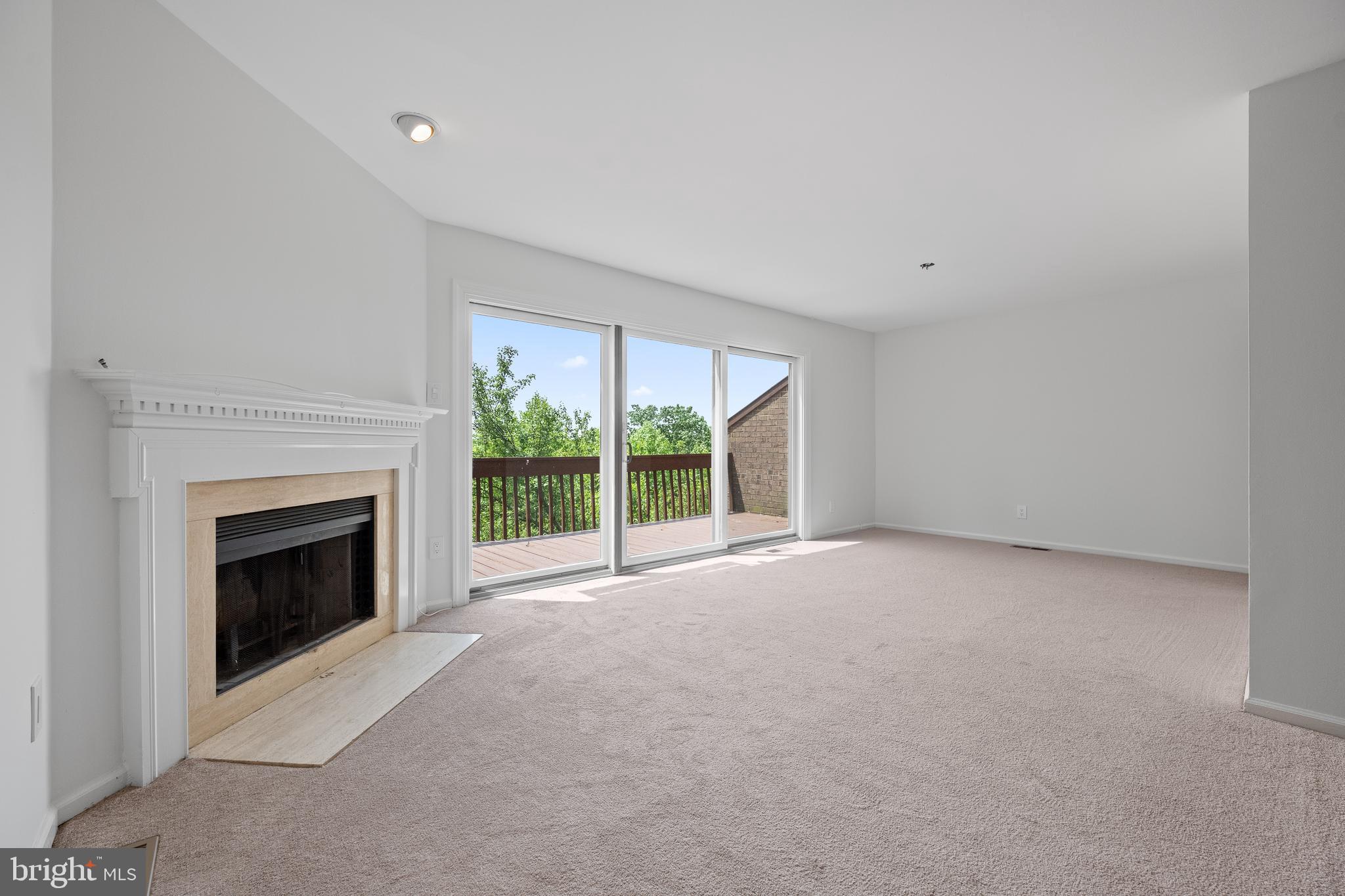 105 Timothy Circle Wayne, PA 19087 - Photo 16 of 31 a view of an empty room with a fireplace and a window