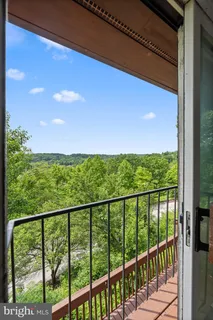 a view of balcony with wooden floor