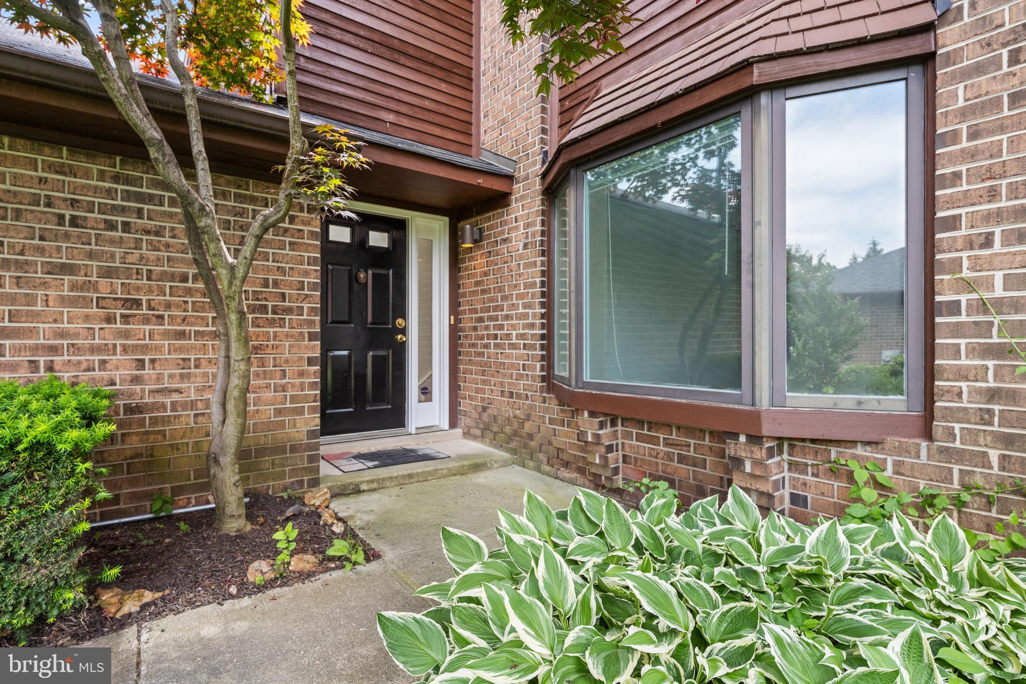 105 Timothy Circle Wayne, PA 19087 - Photo 4 of 31 a front view of a house with a garden