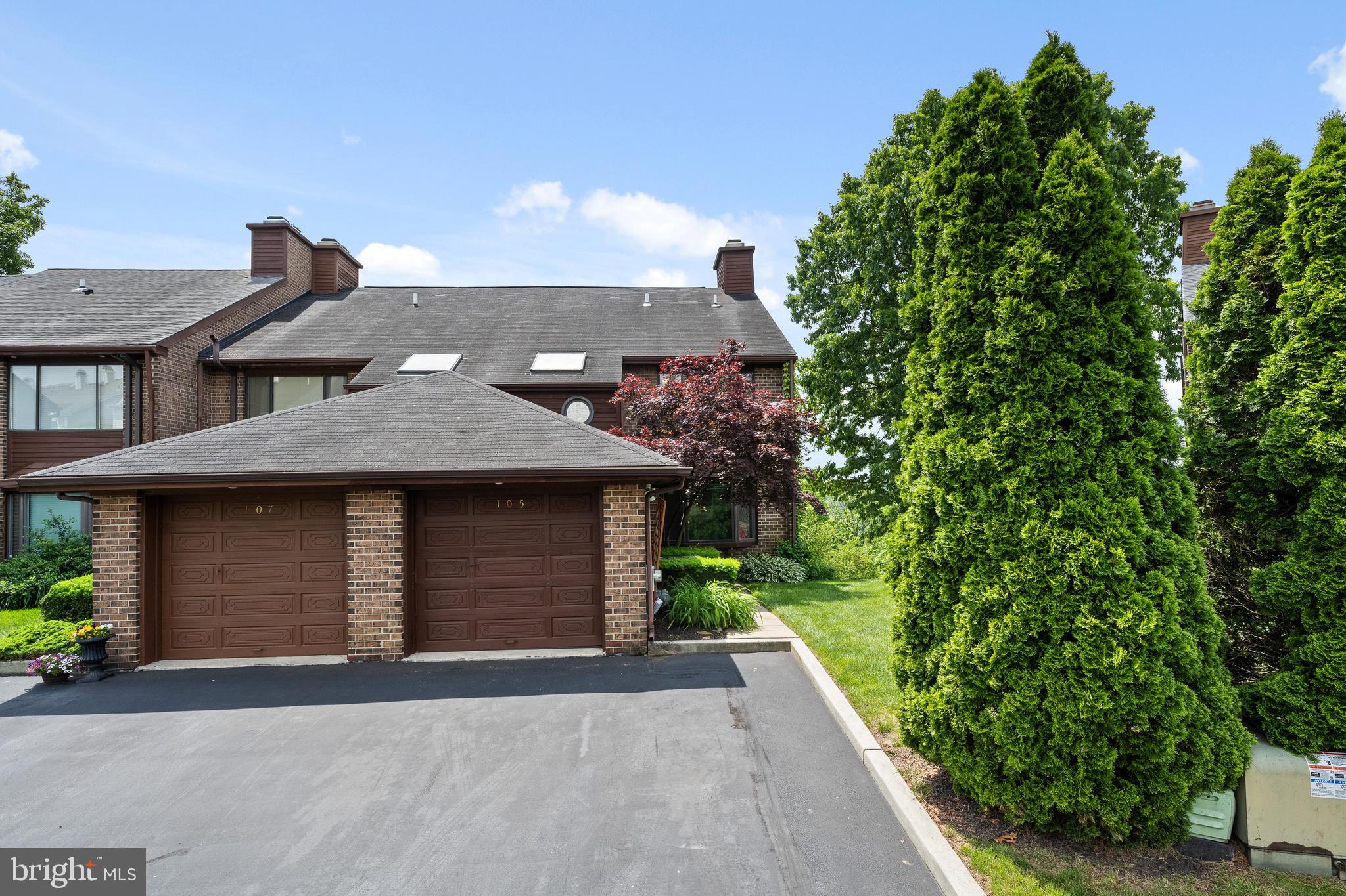 105 Timothy Circle Wayne, PA 19087 - Photo 5 of 31 a front view of a house with a yard and garage