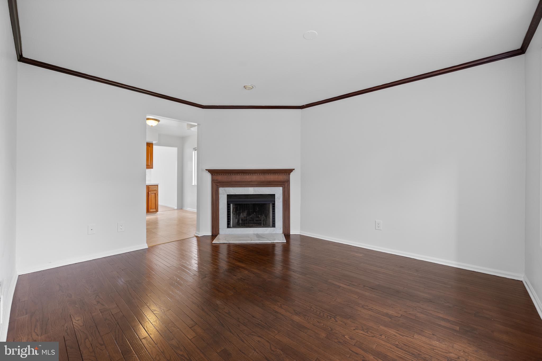 105 Timothy Circle Wayne, PA 19087 - Photo 9 of 31 a view of empty room with wooden floor and fireplace