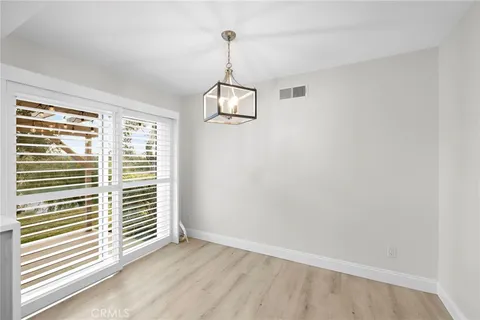 wooden floor in an empty room and a window
